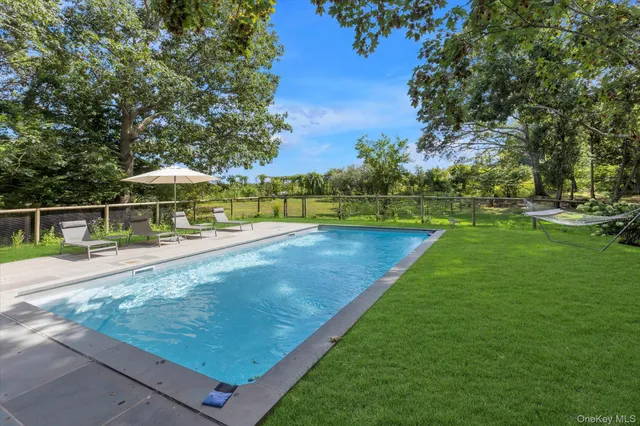 a view of a swimming pool with a patio