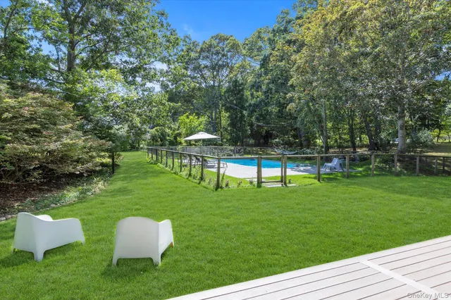 a house view with a sitting space and garden