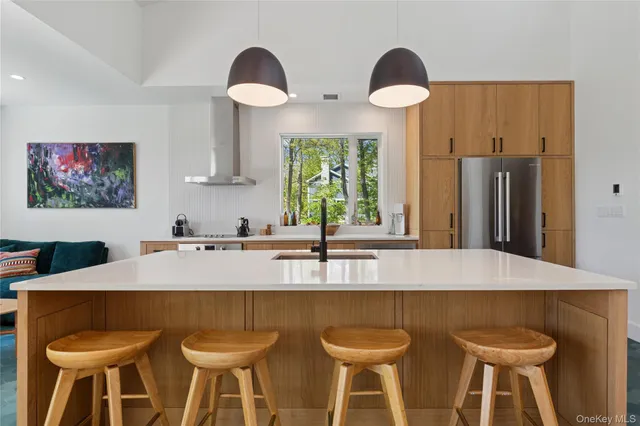 a kitchen with a table and chairs in it