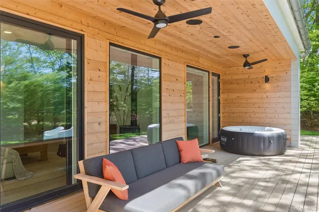 a outdoor space with patio the couches and a dining table with garden view