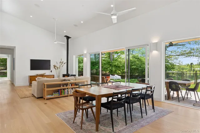 a view of a dining room with furniture window and outside view