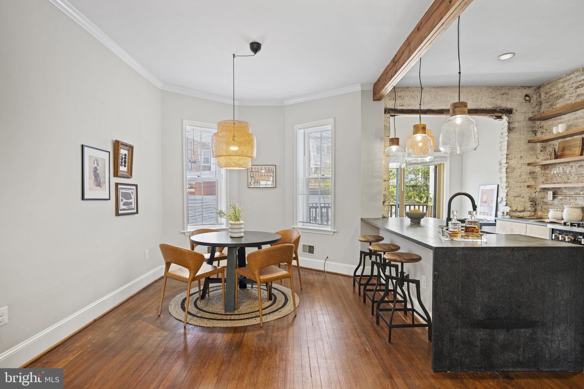 115 R Street Northwest Washington, DC 20001 - Photo 11 of 48 a dining room with furniture a window and wooden floor