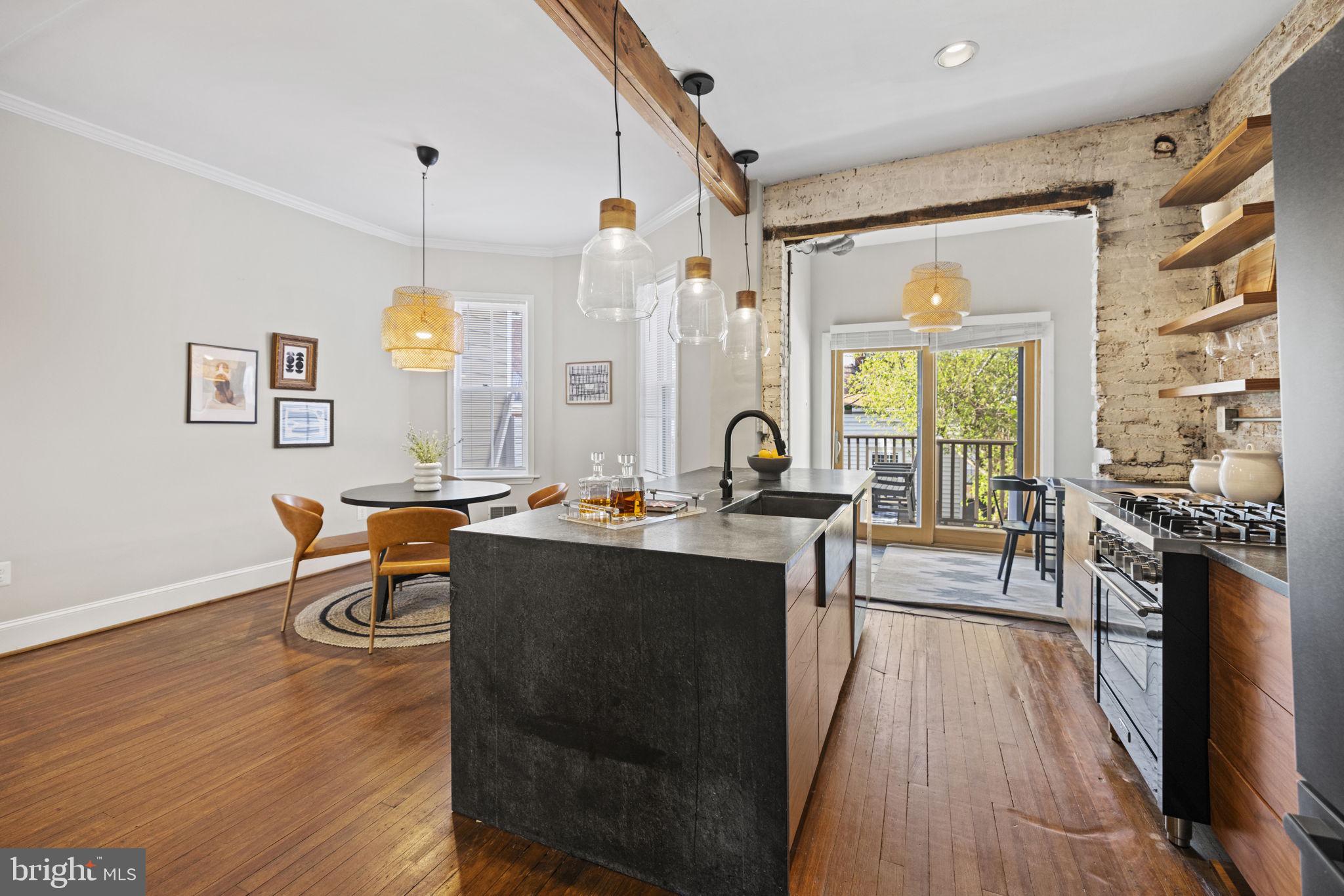 115 R Street Northwest Washington, DC 20001 - Photo 14 of 48 a view of a dining room with furniture a chandelier and wooden floor