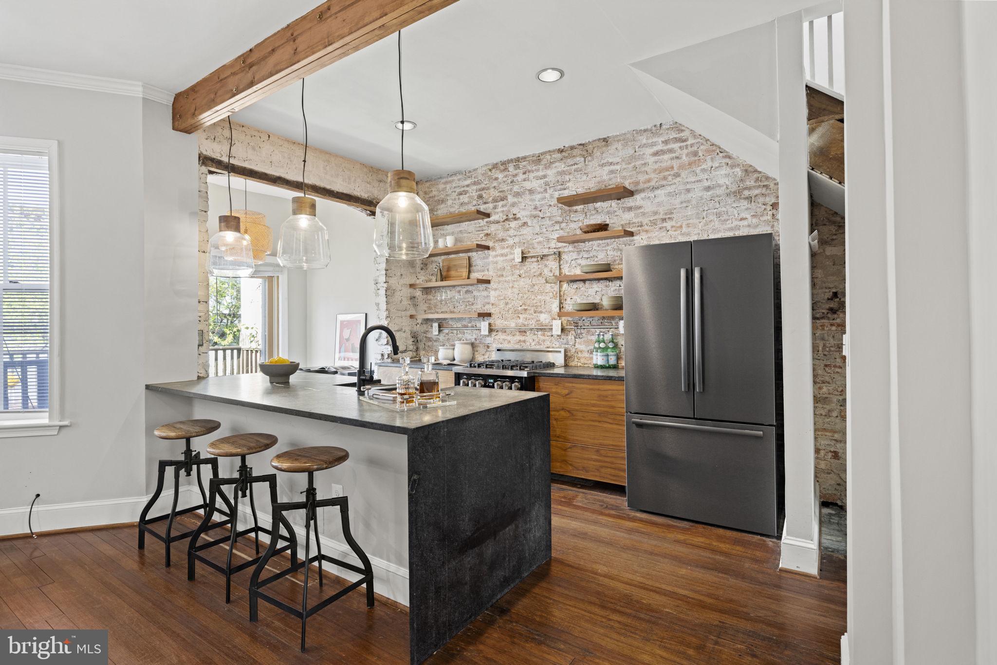115 R Street Northwest Washington, DC 20001 - Photo 16 of 48 a kitchen with stainless steel appliances granite countertop a refrigerator and a sink