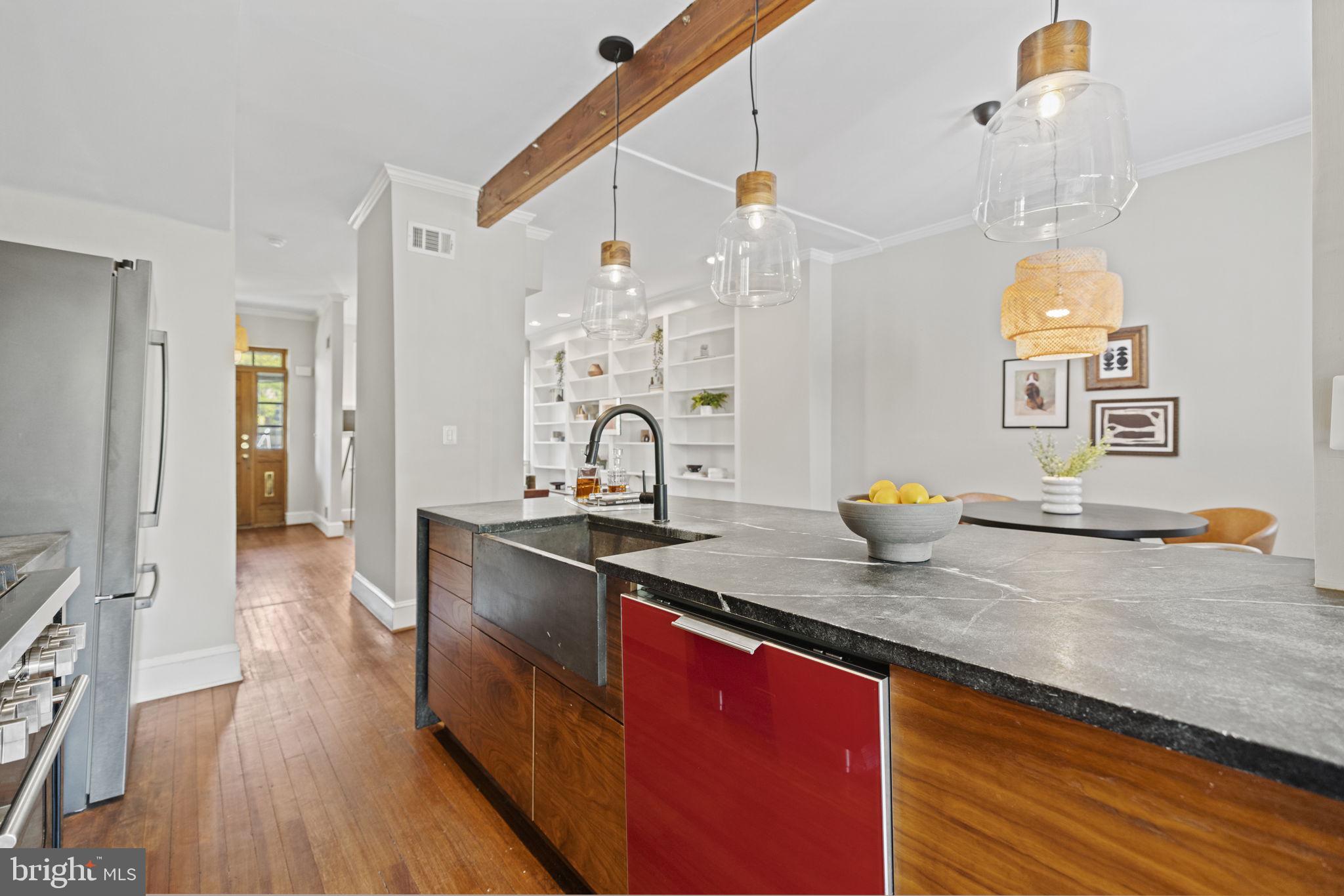115 R Street Northwest Washington, DC 20001 - Photo 18 of 48 a kitchen with sink a stove and cabinets
