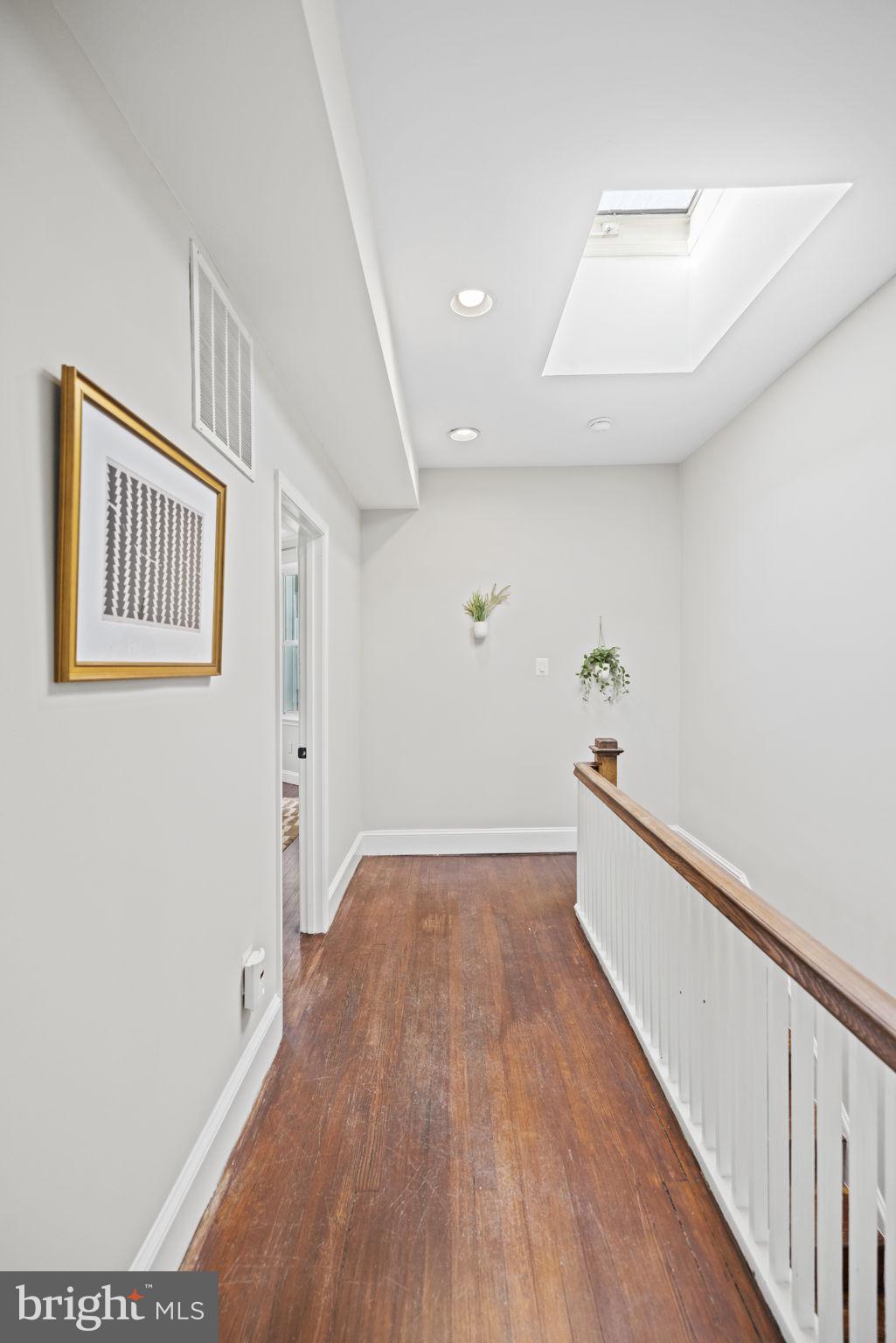 115 R Street Northwest Washington, DC 20001 - Photo 23 of 48 a view of hallway with stairs and wooden floor