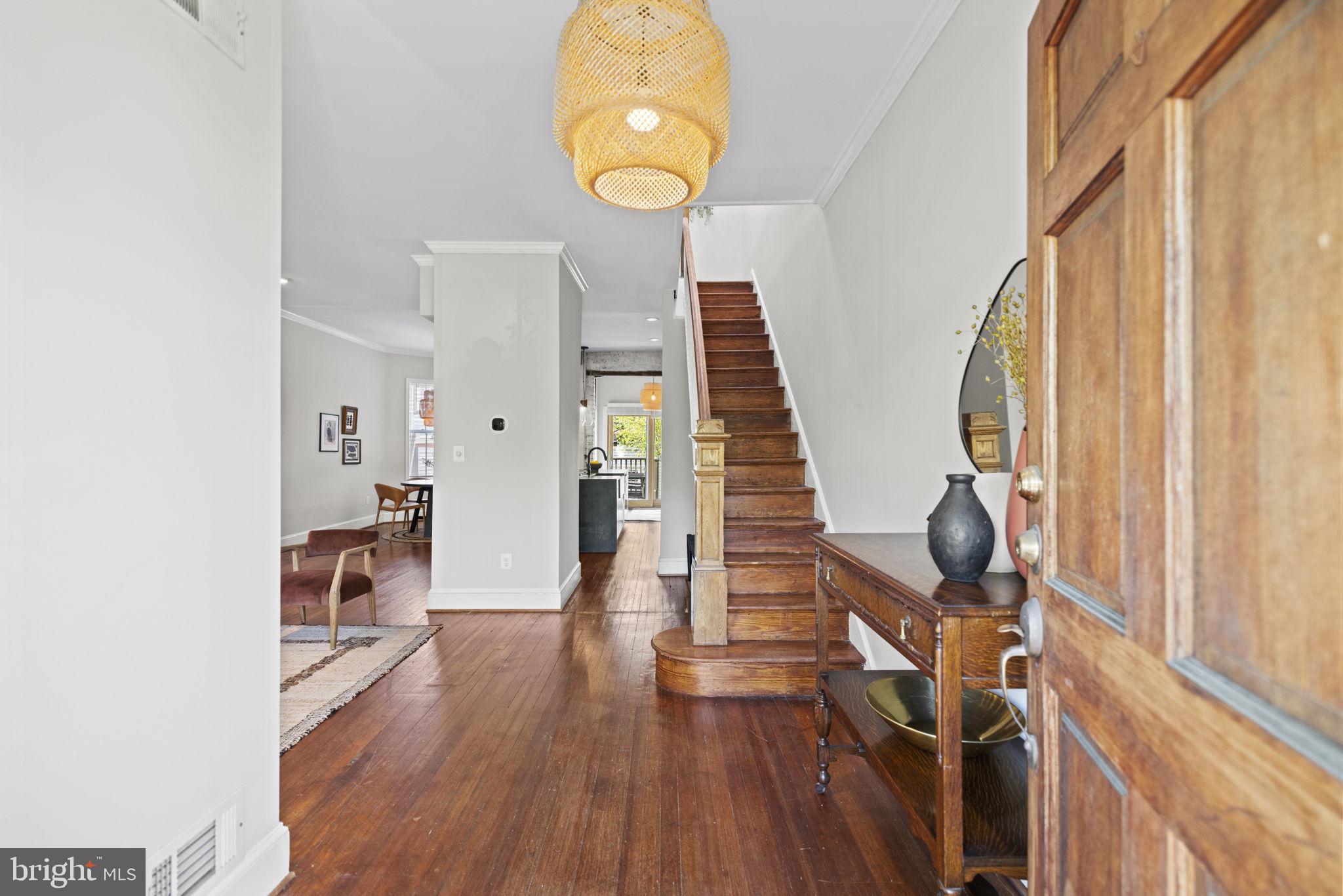 115 R Street Northwest Washington, DC 20001 - Photo 3 of 48 a view of a hallway with wooden floor and entryway