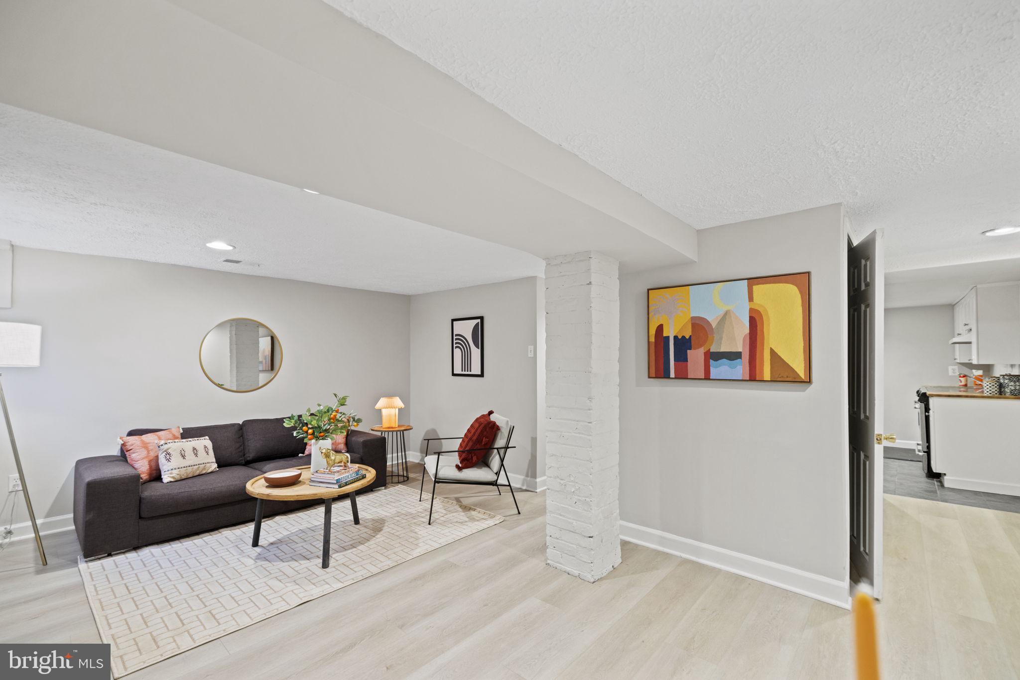 115 R Street Northwest Washington, DC 20001 - Photo 35 of 48 a living room with furniture and a wooden floor