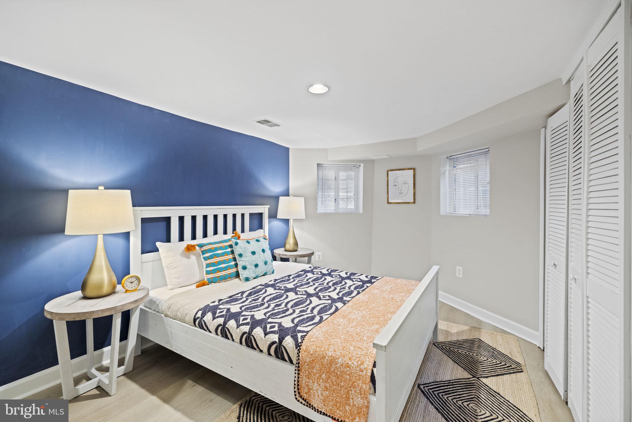 115 R Street Northwest Washington, DC 20001 - Photo 39 of 48 a bedroom with a bed a lamp and a window