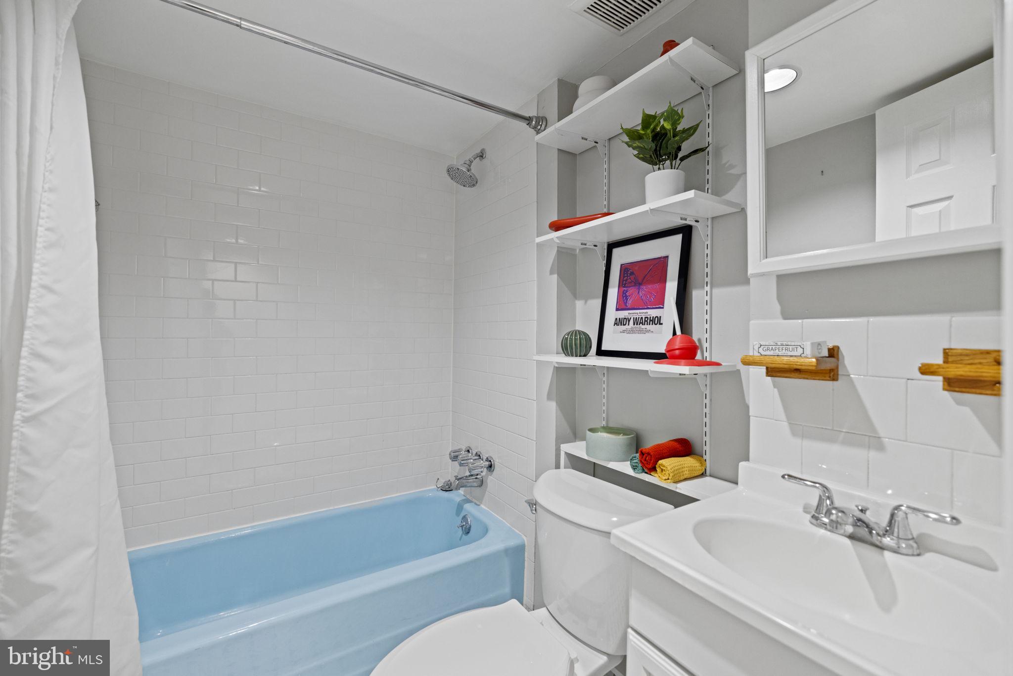 115 R Street Northwest Washington, DC 20001 - Photo 40 of 48 a bathroom with a sink a bath tub and a shower