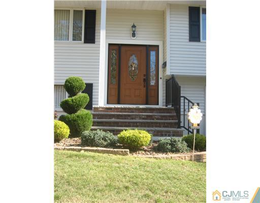 39 Gramercy Road Old Bridge, NJ 08857 - Photo 3 of 20 a front view of a house with garden