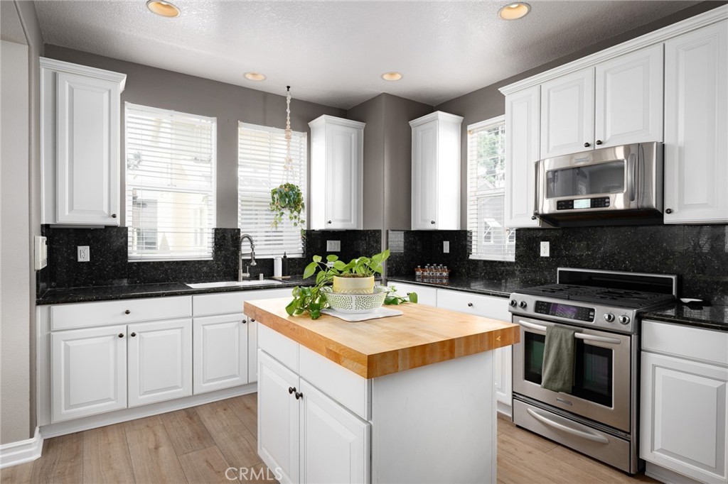 41 Ethereal Ladera Ranch, CA 92694 - Photo 11 of 35 a kitchen with appliances a sink and cabinets
