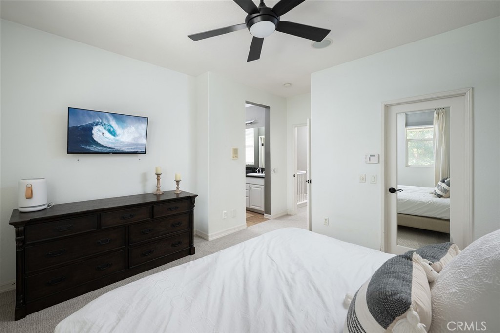 41 Ethereal Ladera Ranch, CA 92694 - Photo 18 of 35 a bedroom with a bed and a chandelier