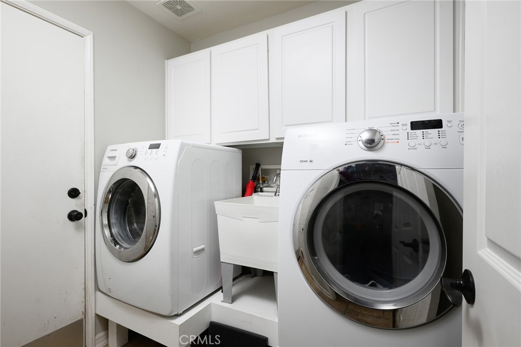41 Ethereal Ladera Ranch, CA 92694 - Photo 27 of 35 a utility room with dryer and washer