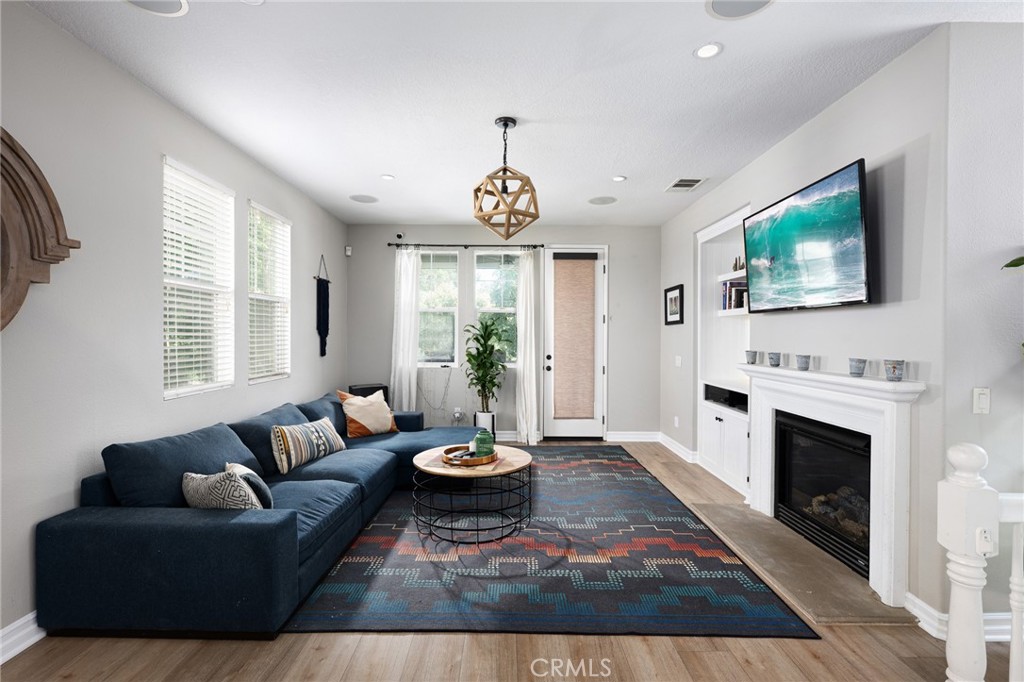 41 Ethereal Ladera Ranch, CA 92694 - Photo 6 of 35 a living room with furniture a fireplace and a flat screen tv