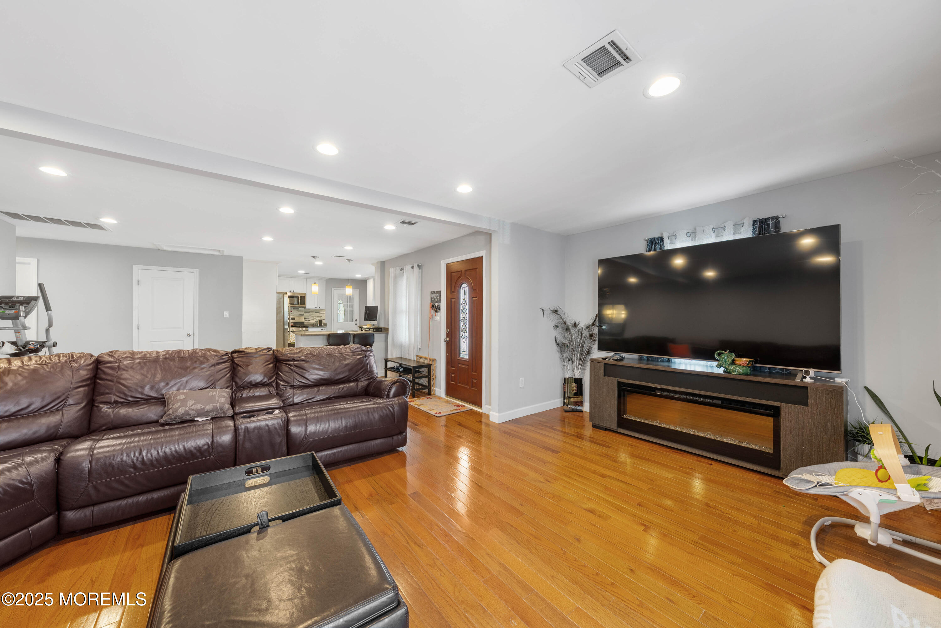 436 Applegate Avenue Toms River, NJ 08757 - Photo 2 of 27 a living room with furniture and a flat screen tv
