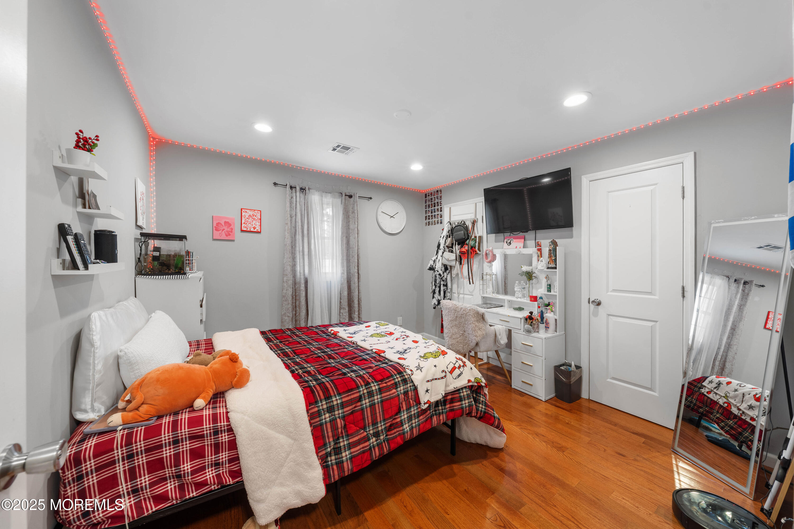 436 Applegate Avenue Toms River, NJ 08757 - Photo 10 of 27 a bedroom with a bed and a flat screen tv