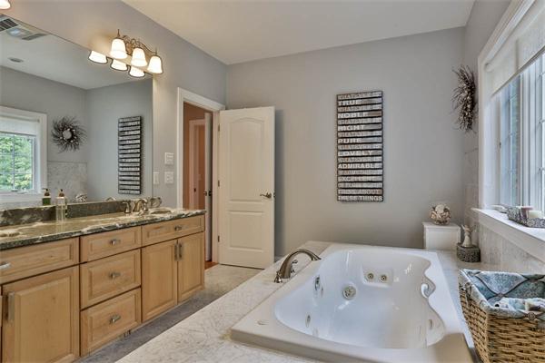 5 Snowcrest Run North Reading, MA 01864 - Photo 21 of 30 a bathroom with a tub a sink and a large mirror