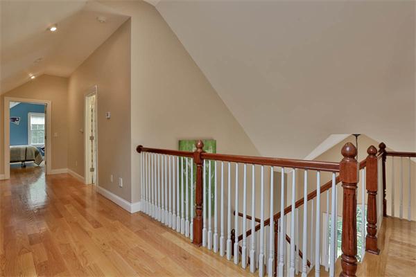 5 Snowcrest Run North Reading, MA 01864 - Photo 23 of 30 a view of a hallway with wooden floor and stairs
