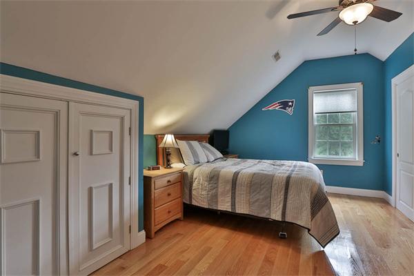 5 Snowcrest Run North Reading, MA 01864 - Photo 26 of 30 a bedroom with a bed and a chandelier