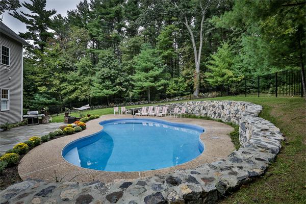 5 Snowcrest Run North Reading, MA 01864 - Photo 29 of 30 a view of a swimming pool with a yard and sitting space
