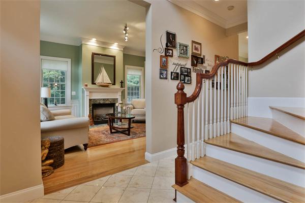 5 Snowcrest Run North Reading, MA 01864 - Photo 3 of 30 a living room with furniture a fireplace and a chandelier