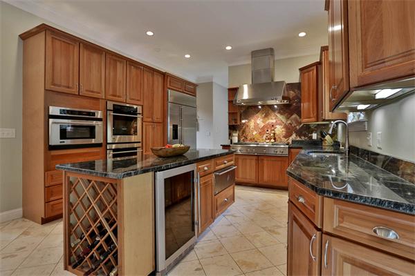 5 Snowcrest Run North Reading, MA 01864 - Photo 8 of 30 a kitchen with stainless steel appliances granite countertop a stove a sink and a microwave