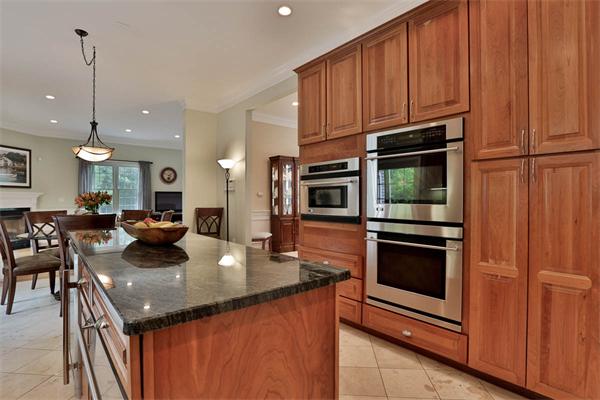 5 Snowcrest Run North Reading, MA 01864 - Photo 10 of 30 a kitchen with stainless steel appliances granite countertop a sink a microwave and chairs