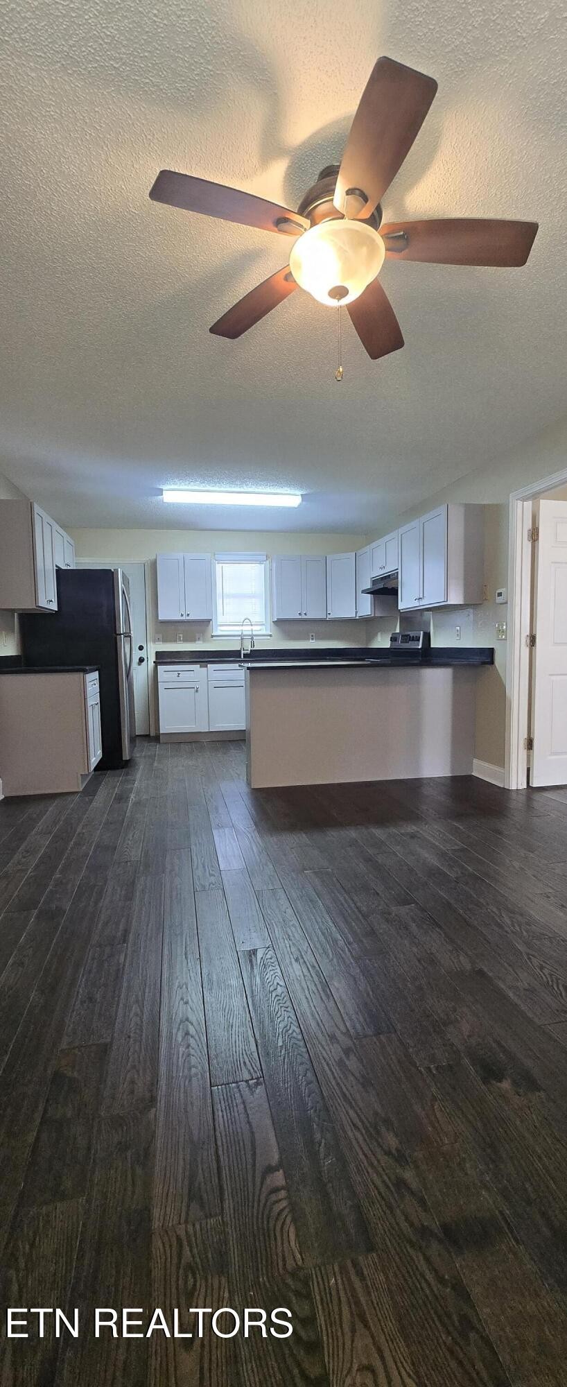 178 Fairview Road Crossville, TN 38571 - Photo 4 of 13 a view of a room with a wooden floor