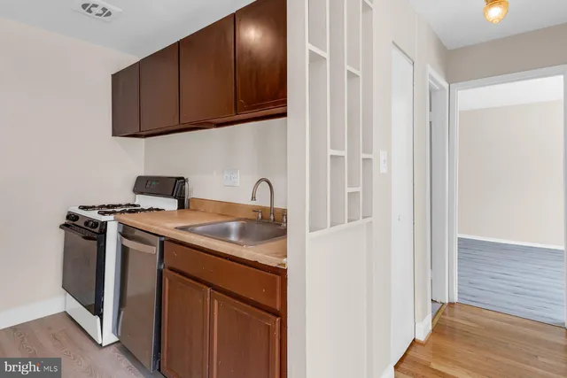 a view of a kitchen with sink and washing machine