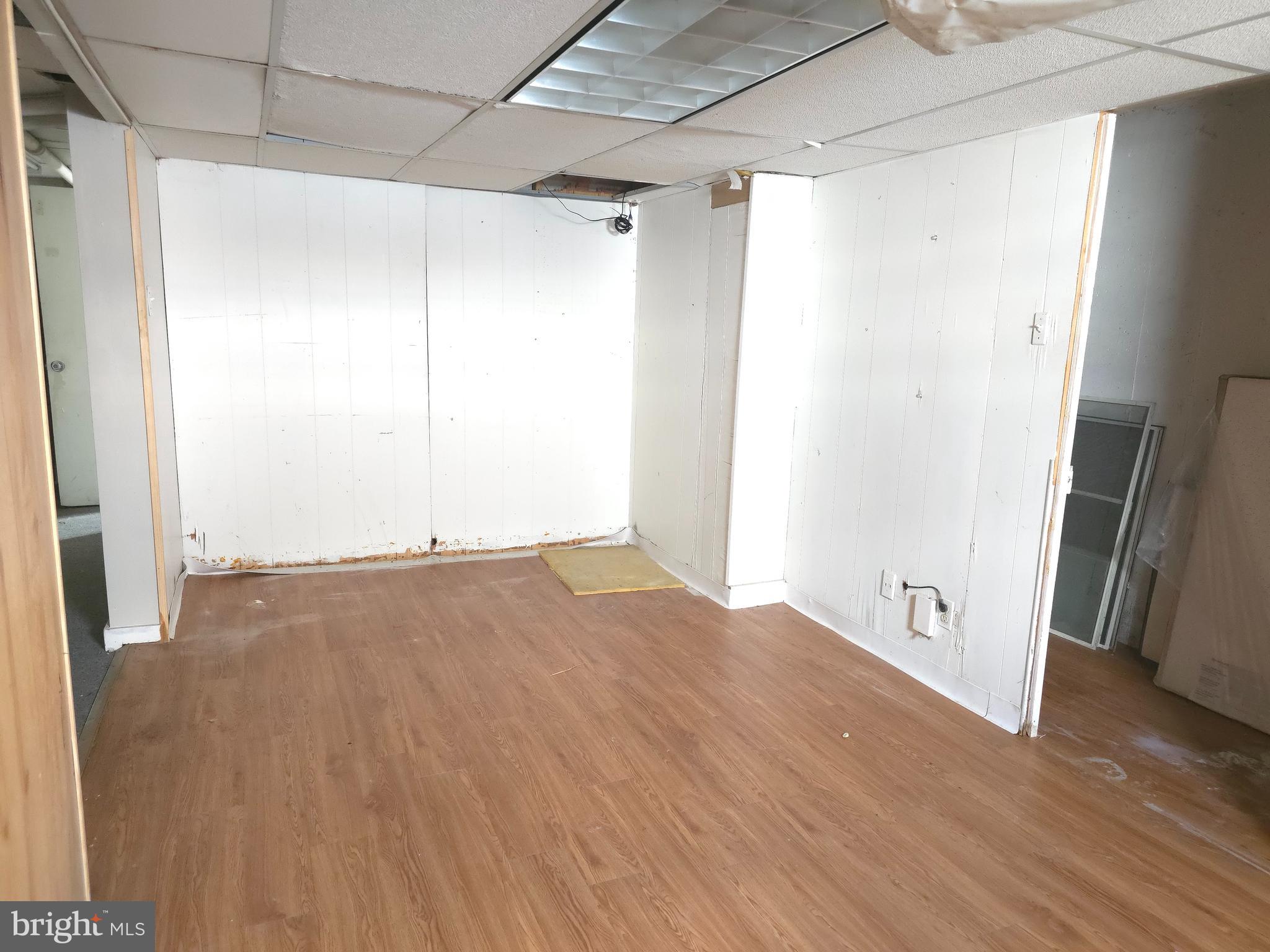 210 Long Lane Upper Darby, PA 19082 - Photo 11 of 21 a view of an empty room with wooden floor and a window