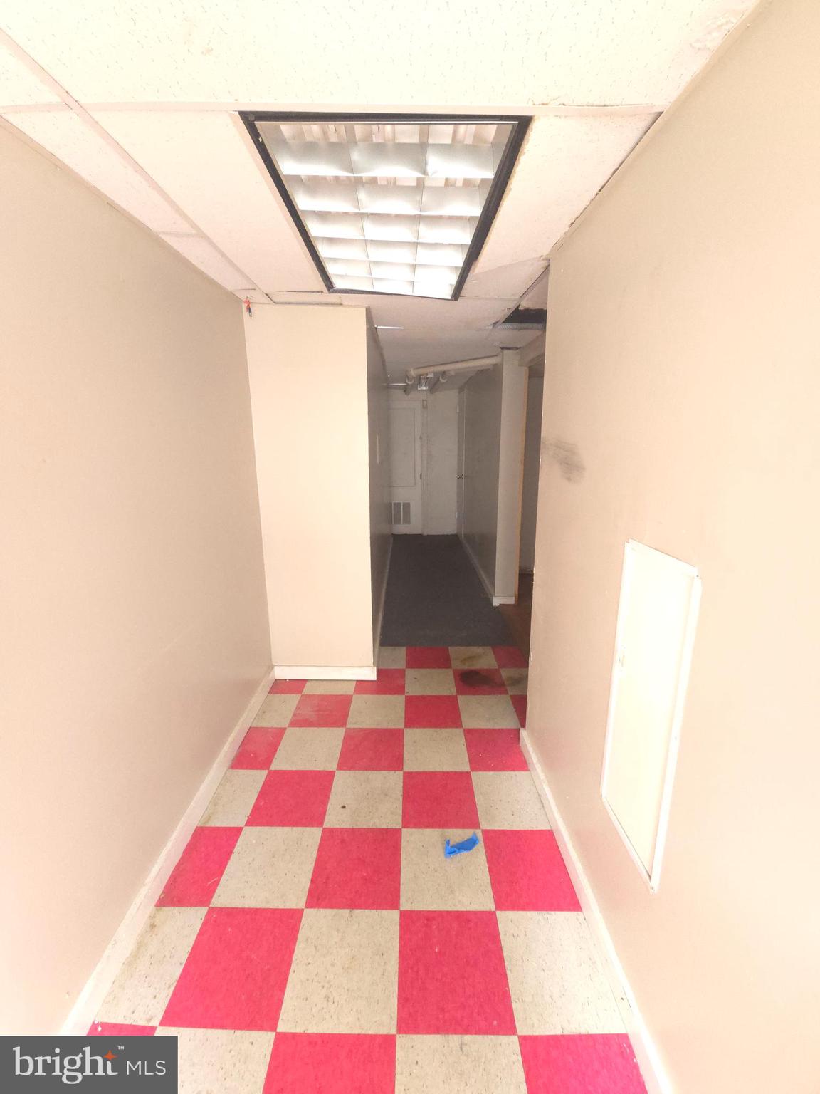 210 Long Lane Upper Darby, PA 19082 - Photo 14 of 21 a rug and a black white checkered floor