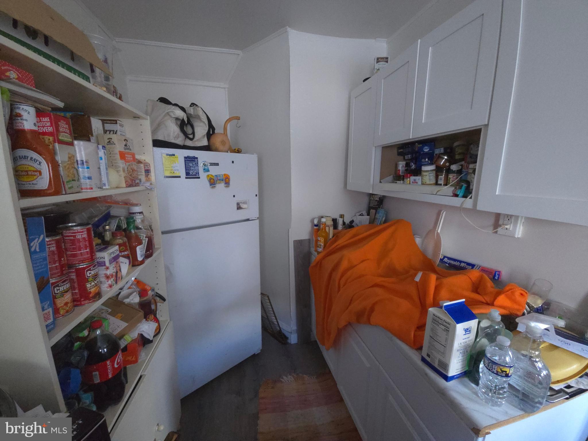 210 Long Lane Upper Darby, PA 19082 - Photo 16 of 21 a bedroom with a bed and cabinets