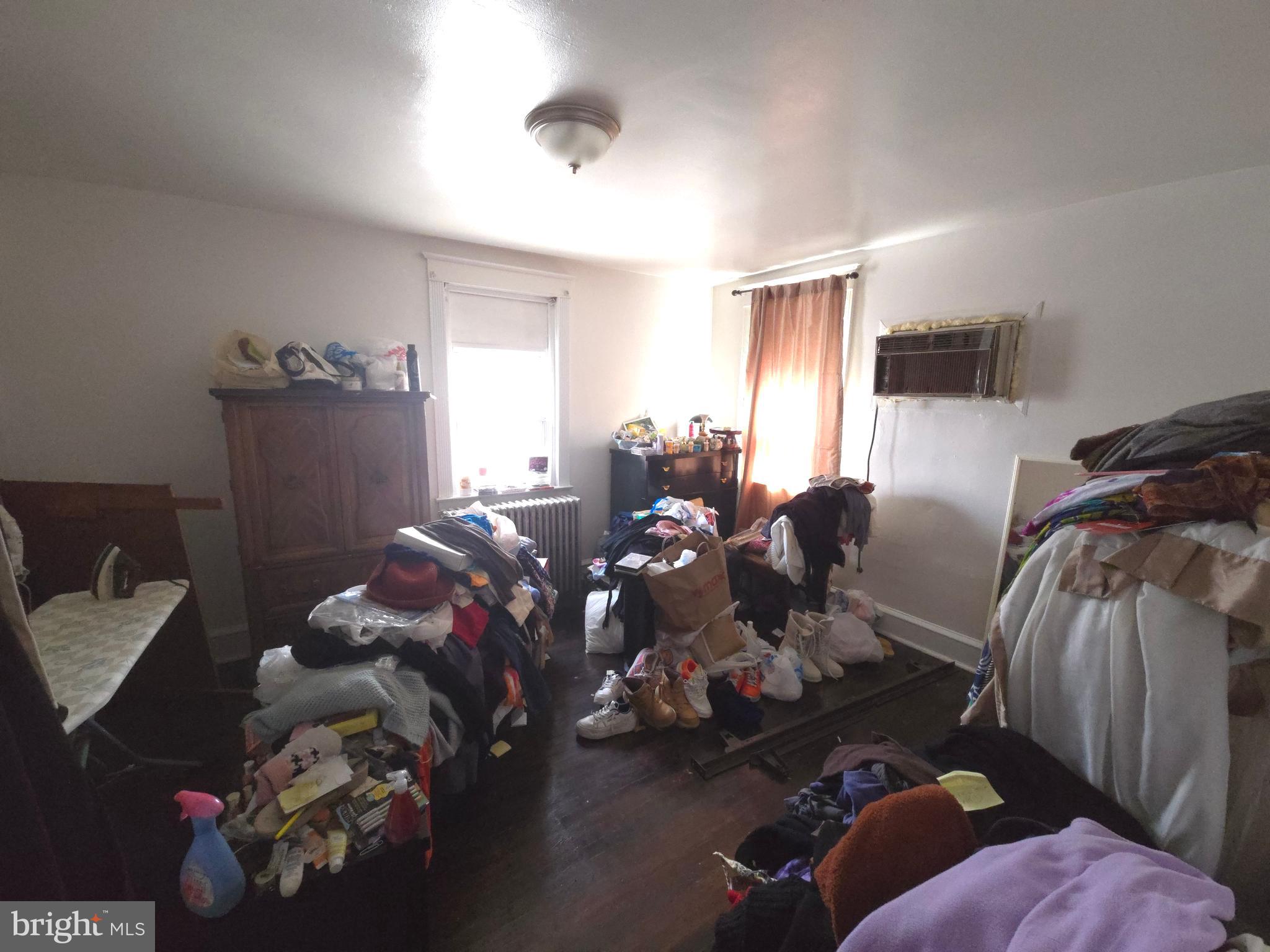 210 Long Lane Upper Darby, PA 19082 - Photo 17 of 21 a living room with furniture chess board and a window