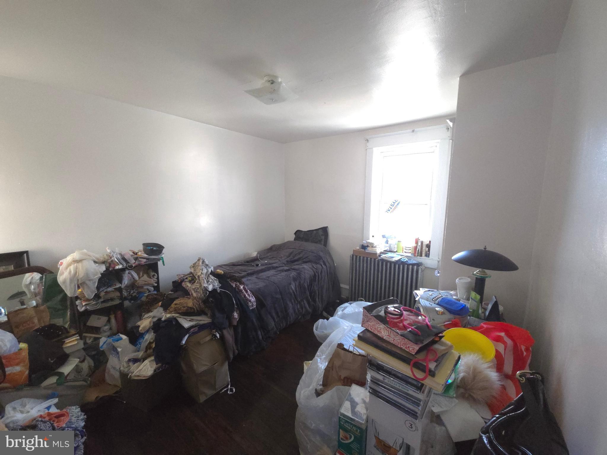 210 Long Lane Upper Darby, PA 19082 - Photo 18 of 21 a bedroom with two beds and a lamp