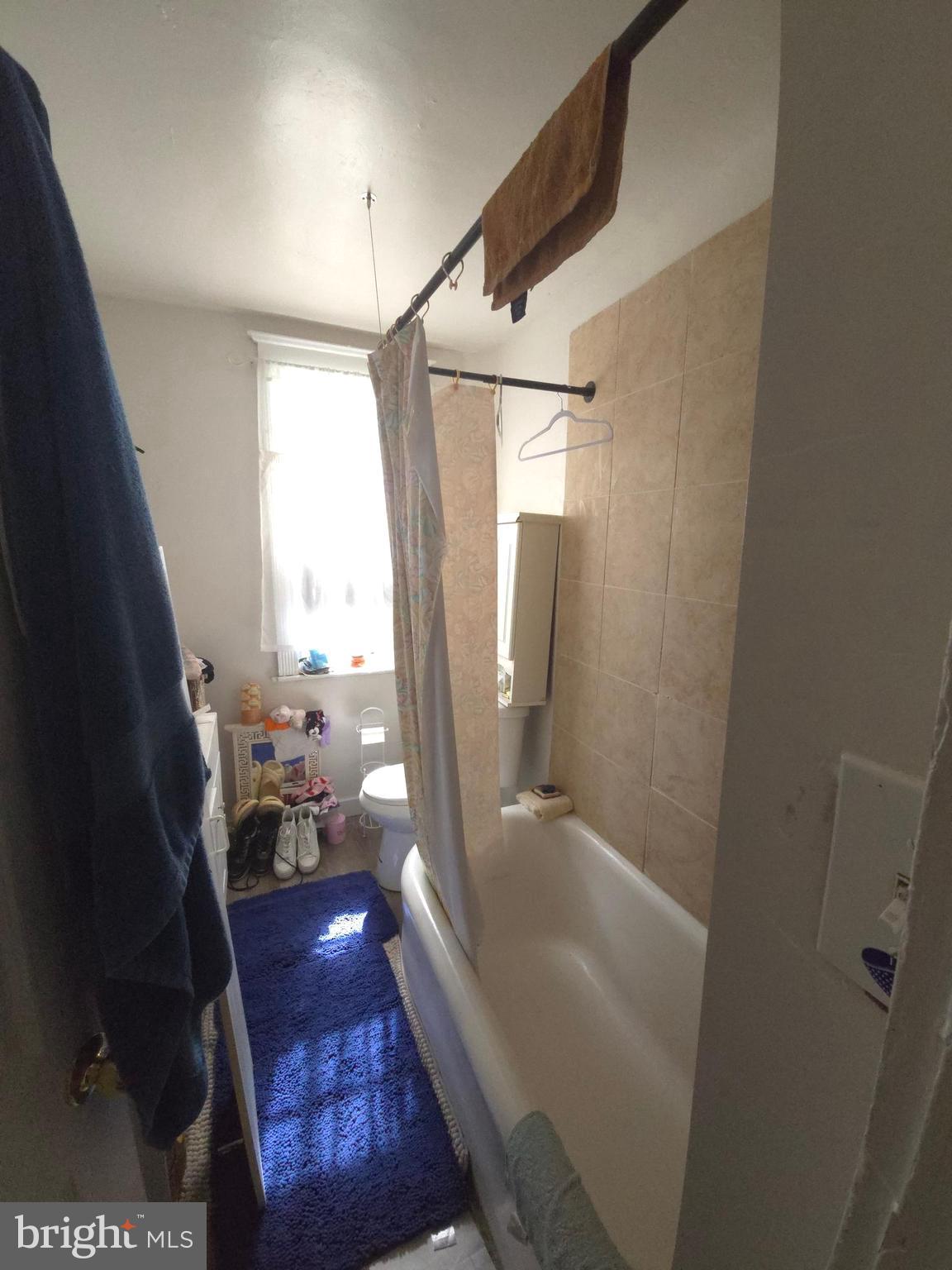 210 Long Lane Upper Darby, PA 19082 - Photo 20 of 21 a bathroom with a bathtub a toilet and a shower