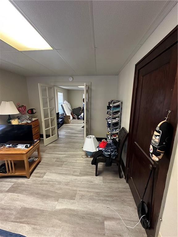 500 Woodward Avenue McKees Rocks, PA 15136 - Photo 13 of 34 a hallway with a couch and dresser with wooden floor