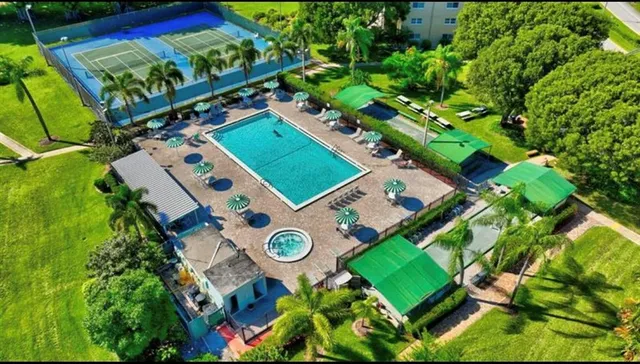 a kitchen with cabinets stainless steel appliances and a counter space
