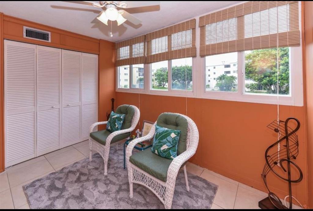 2615 Northeast 3rd Street, Unit 217 Boynton Beach, FL 33435 - Photo 13 of 55 a living room with furniture and a window