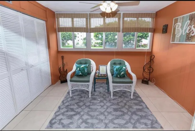 a bedroom with a bed and a table with chair