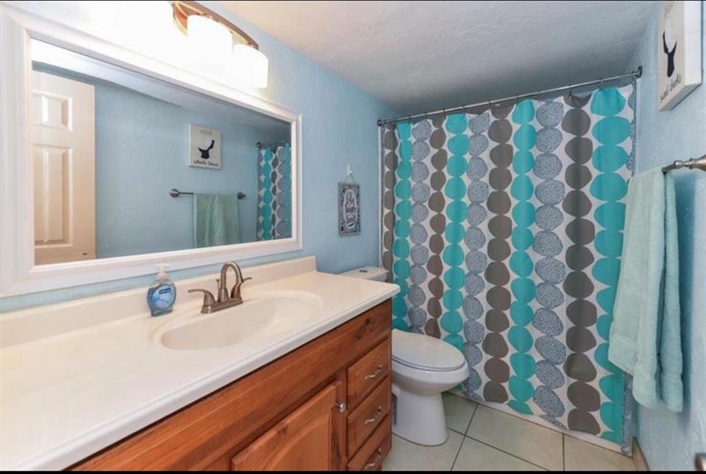 2615 Northeast 3rd Street, Unit 217 Boynton Beach, FL 33435 - Photo 17 of 55 a bathroom with a sink and a mirror