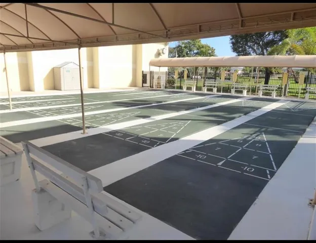 a living room with a table and chairs