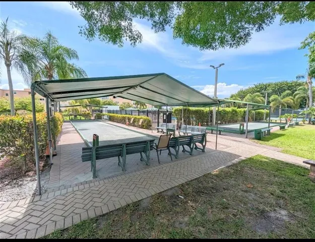 a view of a swimming pool with a patio