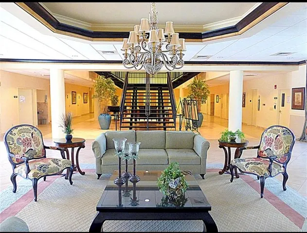 a view of a swimming pool and lounge chairs
