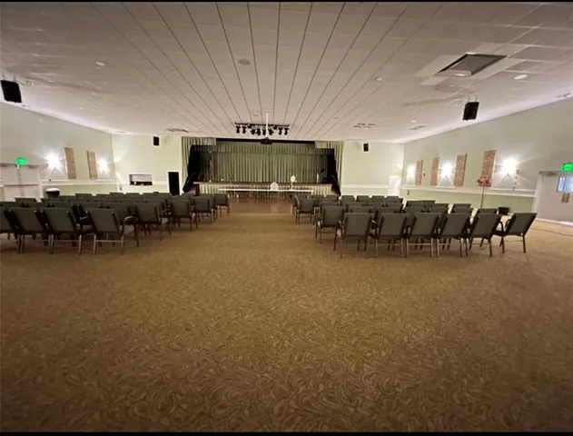 a room with gym equipment and a table