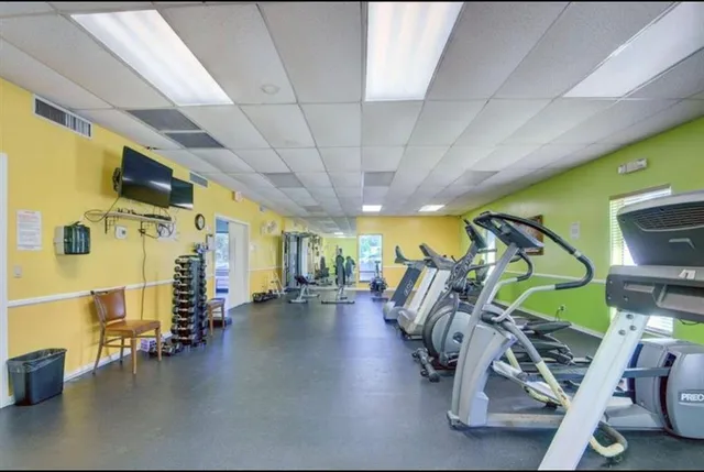 an aerial view of residential houses with outdoor space and river