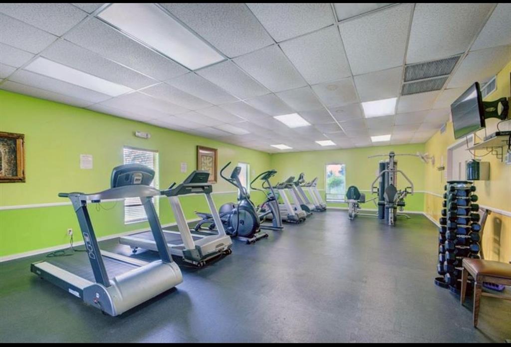 2615 Northeast 3rd Street, Unit 217 Boynton Beach, FL 33435 - Photo 49 of 55 a room with gym equipment and a table