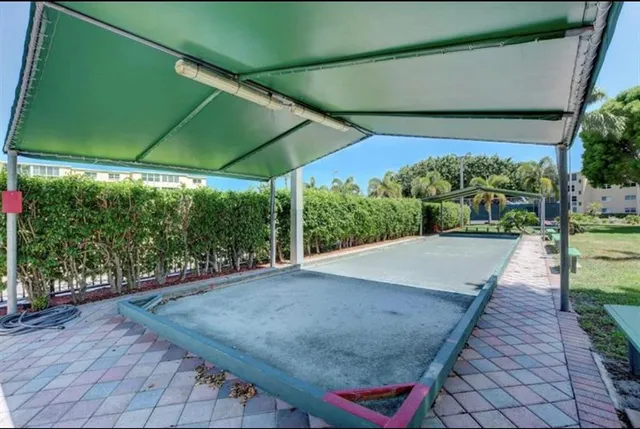 a sign that is in front of flowers