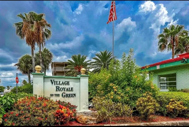a dining room with furniture and a window
