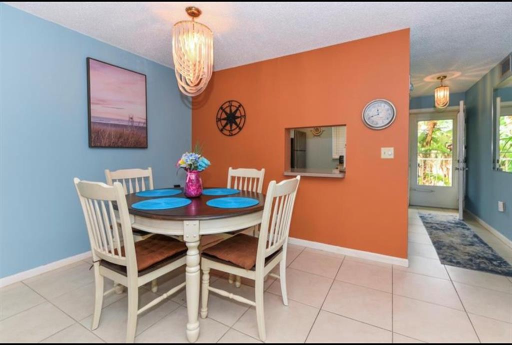 2615 Northeast 3rd Street, Unit 217 Boynton Beach, FL 33435 - Photo 9 of 55 a dining room with furniture and a window